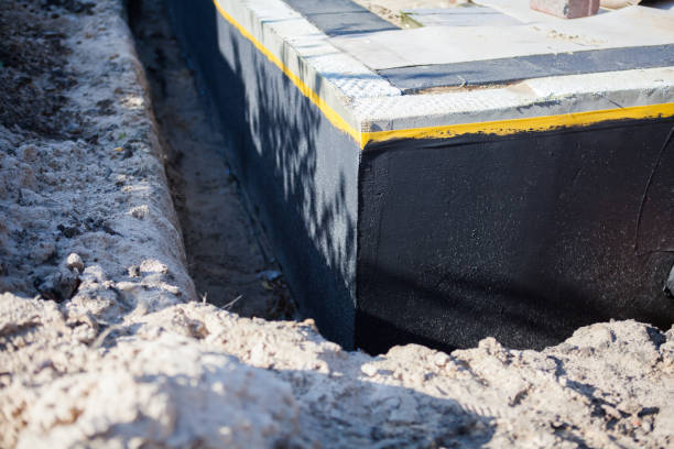 Professional Basement Waterproofing technician working in Columbia, KY